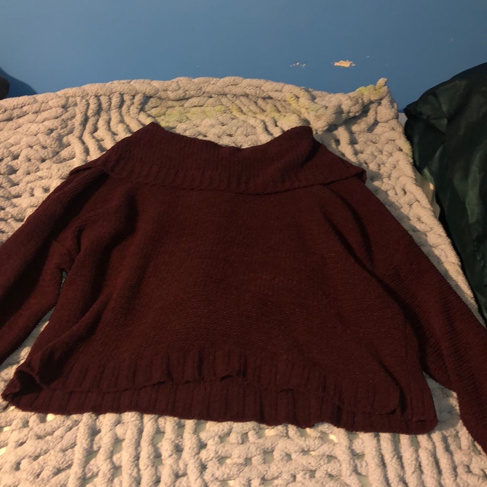 Women’s cowl neck sweater.